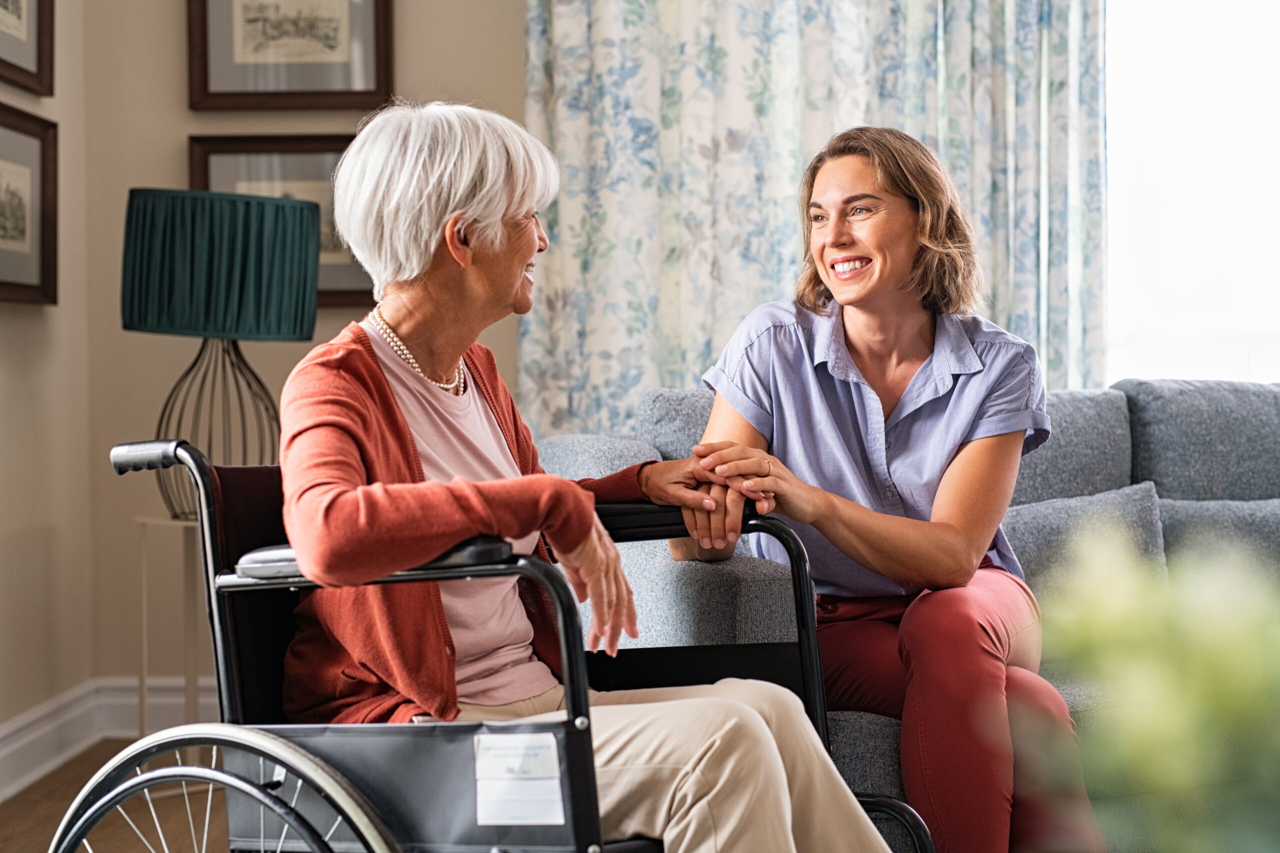 woman conforming an older woman in a wheelchair | March 2022 Issue - Free Christian Lifestyle Magazine | Nashville Christian Family Magazine