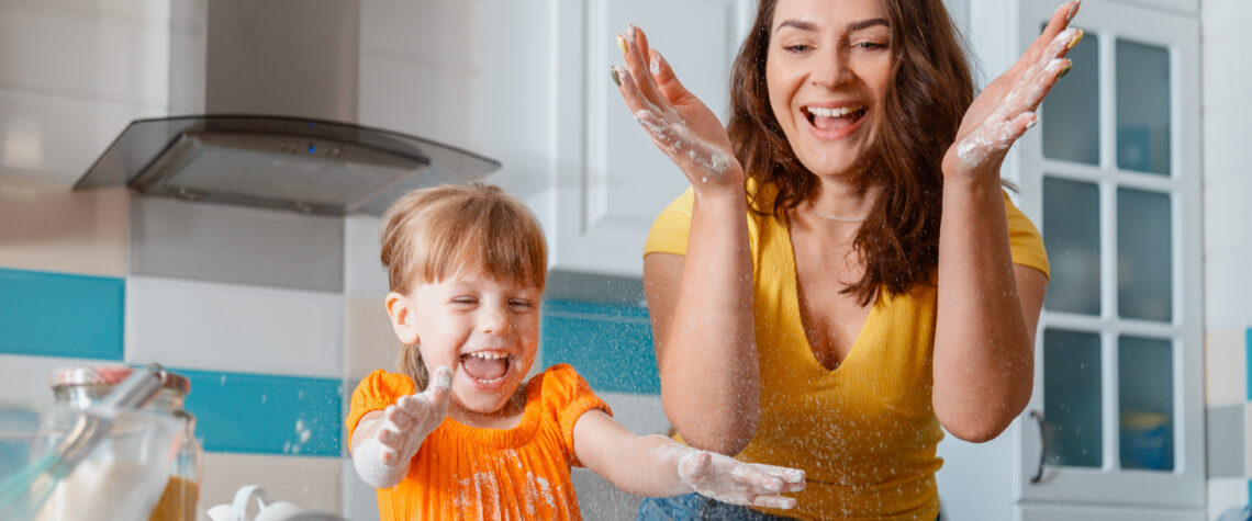 How to Love Your Child Through Words of Affirmation - Mother and daughter having fun & laughing in the kitchen | April 2022 Issue - Free Christian Lifestyle Magazine | Nashville Christian Family Magazine