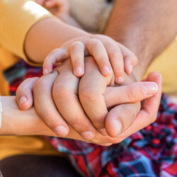 Parents hold the baby hands | April 2022 Issue - Free Christian Lifestyle Magazine | Nashville Christian Family Magazine
