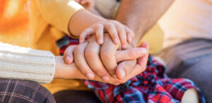 Parents hold the baby hands | April 2022 Issue - Free Christian Lifestyle Magazine | Nashville Christian Family Magazine