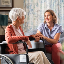 Senior woman in a wheelchair being cared for by a younger woman | Nashville Christian Family Magazine