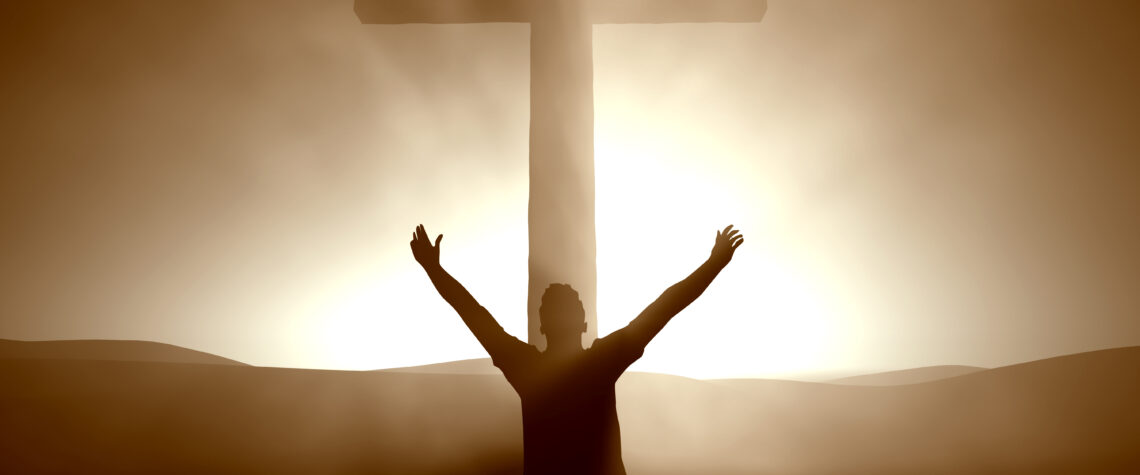 Man kneeling at the cross of Jesus Christ | Nashville Christian Family Magazine