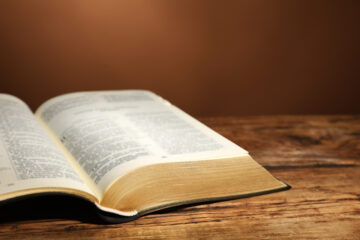Open Bible on wooden table | Nashville Christian Family Magazine - Free Christian Magazine