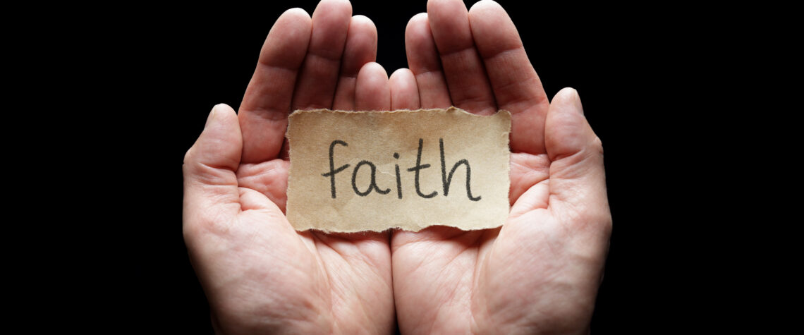 Faith message on paper resting in open hands | Nashville Christian Family Magazine - Free Christian Magazine