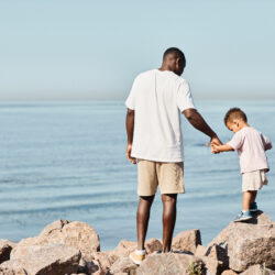 Father and son along the rocky coastline | Nashville Christian Family Magazine - Free Christian Magazine