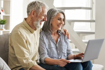 Happy Older Couple looking at a computer | Nashville Christian Family Magazine - Free Christian Magazine