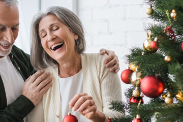 Elderly couple hanging Christmas Tree ornaments | Nashville Christian Family Magazine - Free Christian Magazine