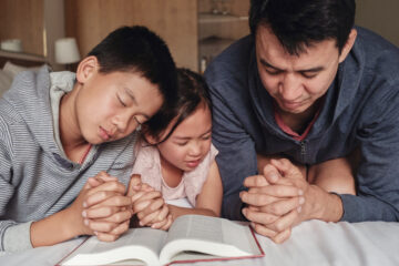 Nashville Christian Family magazine | Free Christian Magazine - Father and his children praying - National Day of Prayer
