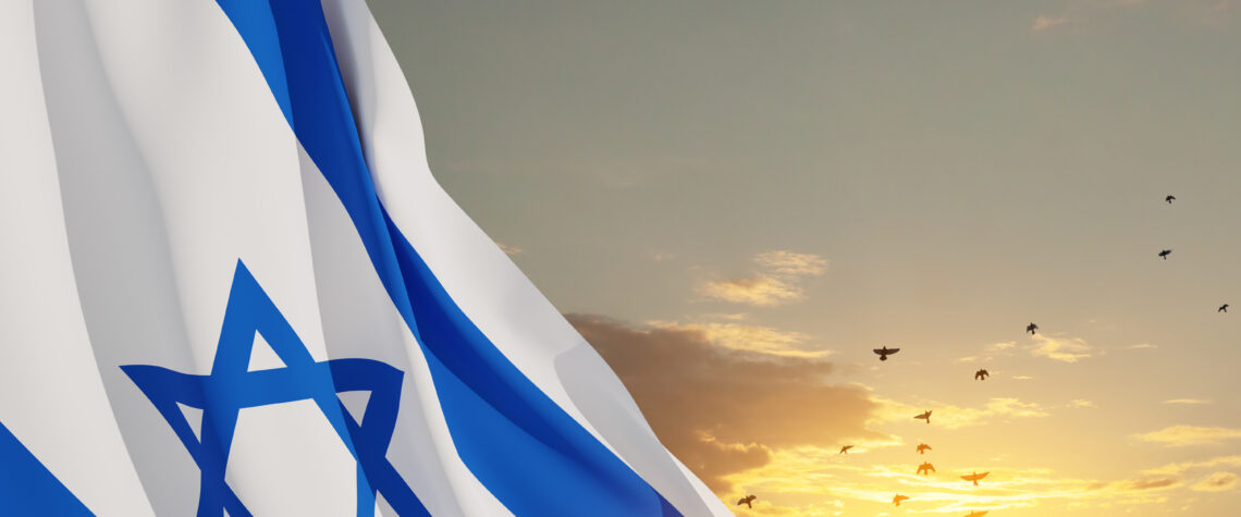 Israel’s Most Sacred, Scary, and Joyous Season - Israel Flag With A Star Of David Over Cloudy Sky Background | Nashville Christian Family Magazine - May 2023 issue - Free Christian Magazine