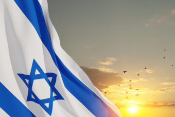 Israel’s Most Sacred, Scary, and Joyous Season - Israel Flag With A Star Of David Over Cloudy Sky Background | Nashville Christian Family Magazine - May 2023 issue - Free Christian Magazine