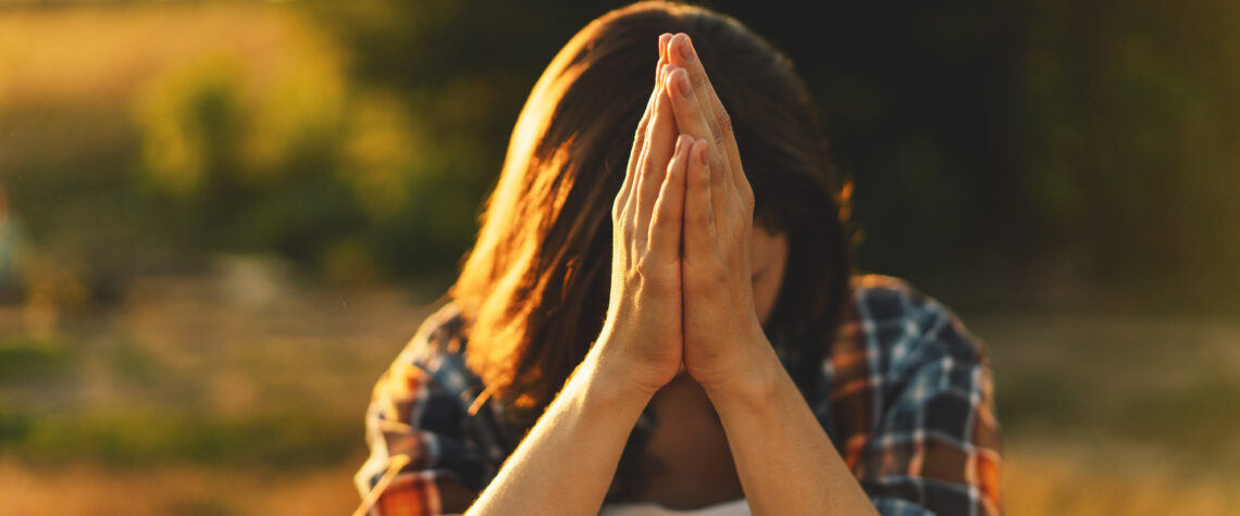 Never Stop Praying - Young Woman Closed Her Eyes, Praying In A Field | Nashville Christian Family Magazine - May 2023 issue - Free Christian Magazine