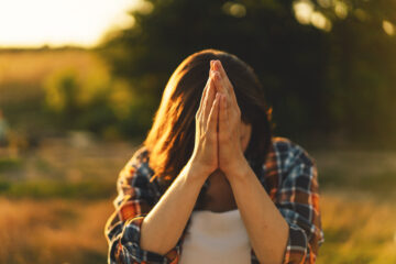 Never Stop Praying - Young Woman Closed Her Eyes, Praying In A Field | Nashville Christian Family Magazine - May 2023 issue - Free Christian Magazine