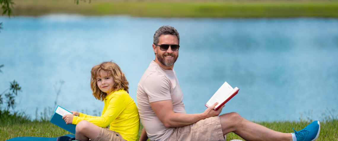5 Summer Reading Tips for Parents - Father & son reading outside | Nashville Christian Family Magazine - June 2023 issue - Free Christian Magazine