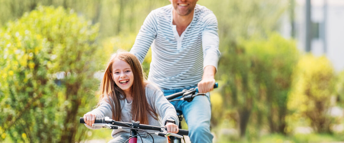 Doug Griffin from TheFish article - Father and daughter riding bicycles | Nashville Christian Family Magazine - June 2023 issue - Free Christian Magazine
