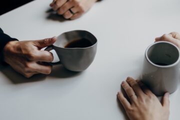 Couple having coffee at a table | Nashville Christian Family Magazine July 2023 issue - free Christian magazine