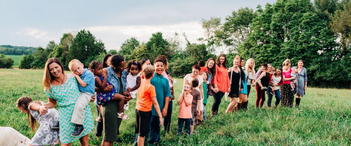 Group of moms and kids in a field | Nashville Christian Family Magazine