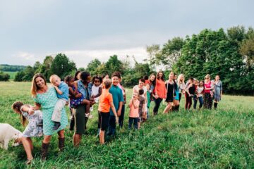 Group of moms and kids in a field | Nashville Christian Family Magazine