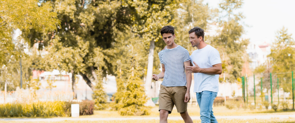 dad and son walking and talking | Nashville Christian Family Magazine - September 2024 issue