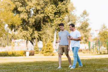 dad and son walking and talking | Nashville Christian Family Magazine - September 2024 issue