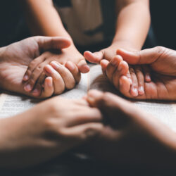 Dedicate Your Home to God - Family praying holding hands | Nashville Christian Family Magazine