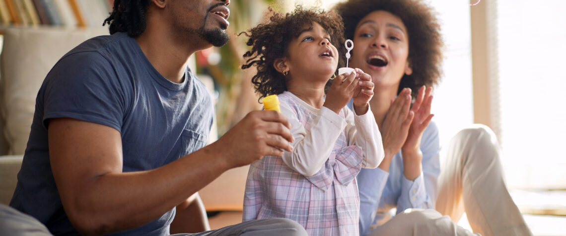 Young parents having a good time with their cute little daughter | Nashville Christian Family Magazine