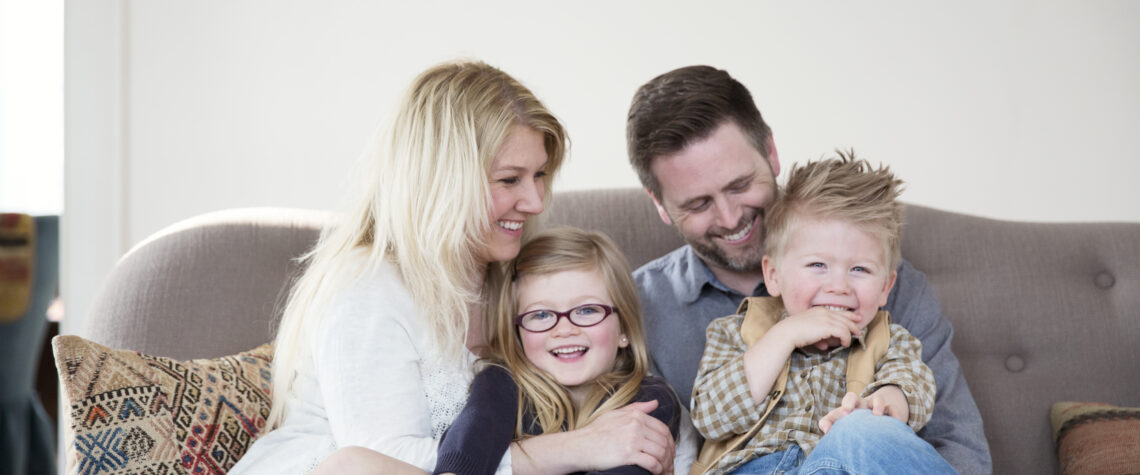 Portrait Of Happy Family In home | Nashville Christian Family Magazine